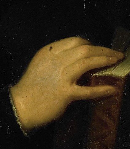 His delicate hand rests on a book, reflecting his scholarly interests.