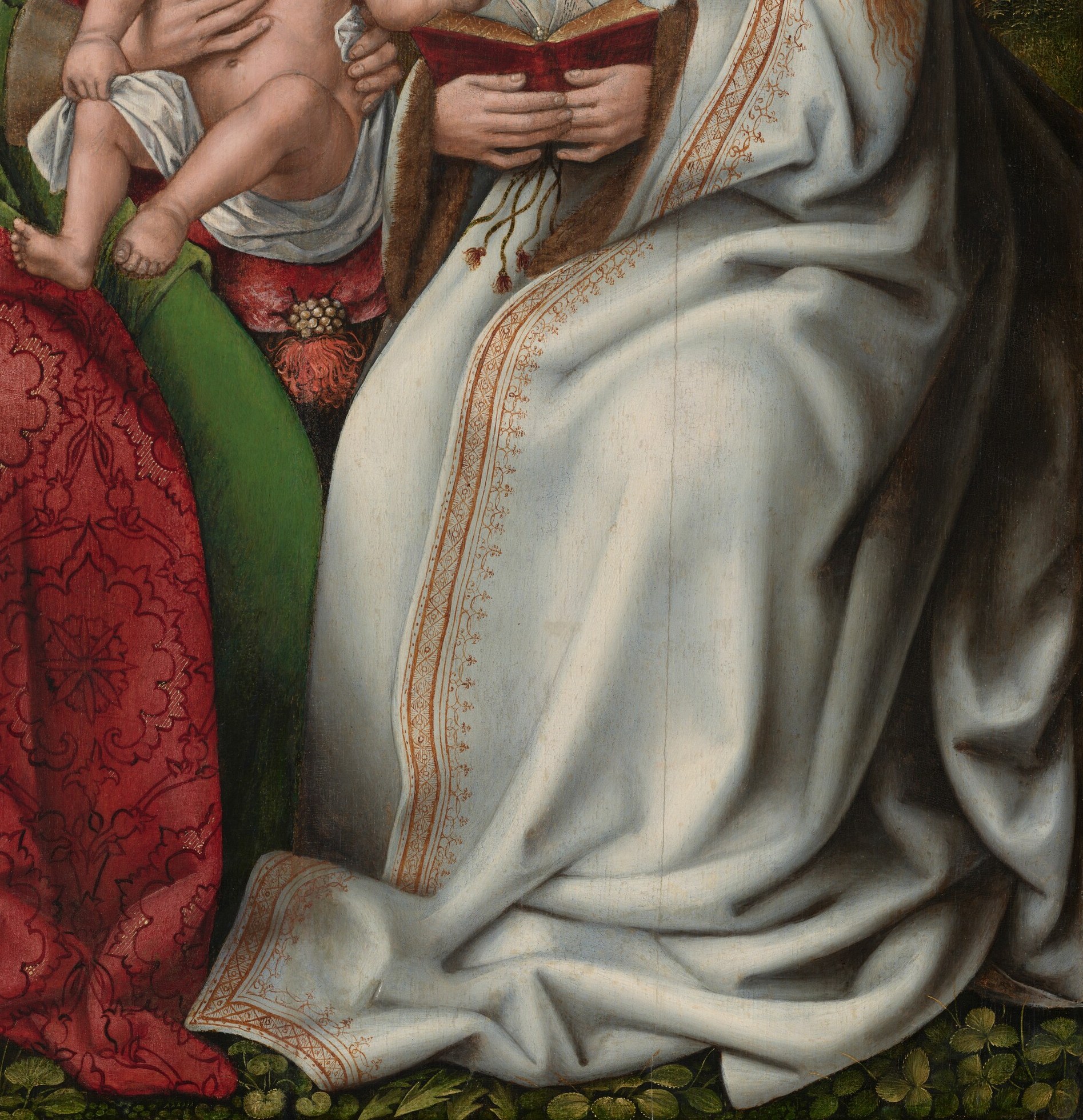 Her mother, Saint Anne, wears a richly brocaded mantle.