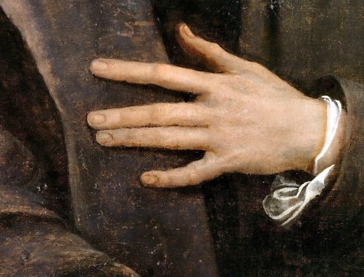 His hand rests on his chest like a Venetian merchant stating his credit.