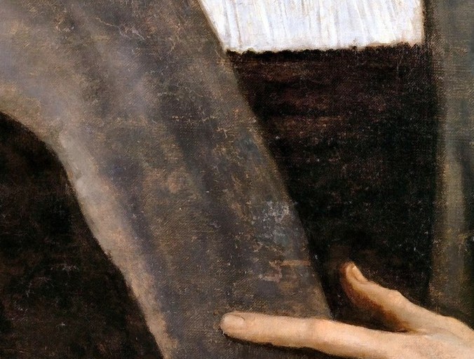The white linen drives light up into the face. A technique, not an accident.