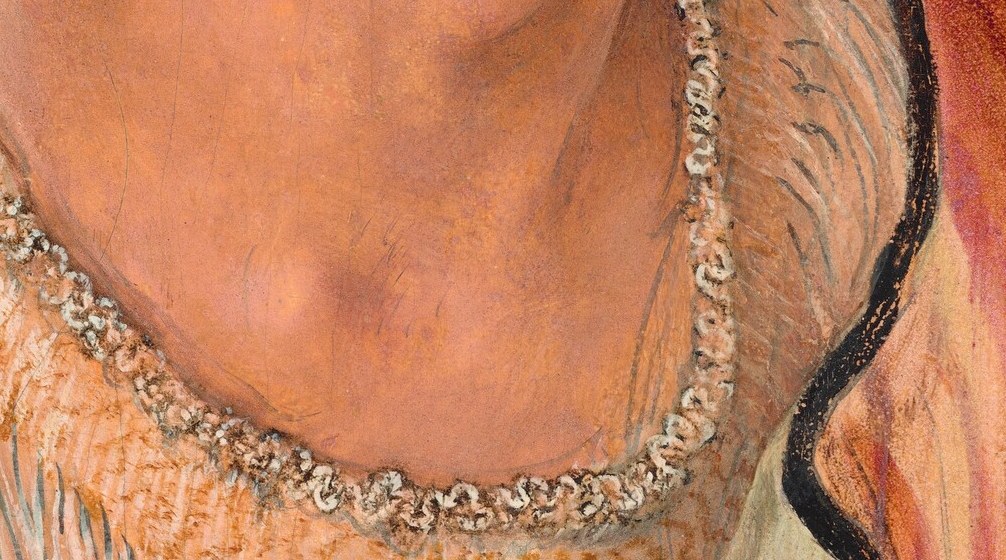 The white beaded collar adds opulence.
