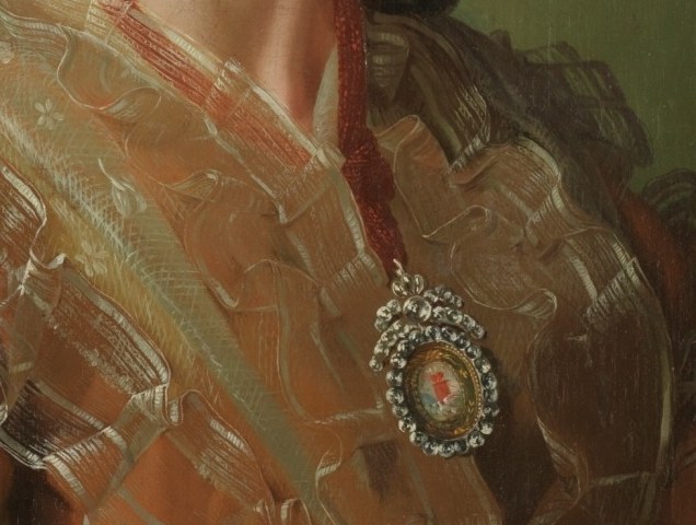 She wears a delicate lace collar, signaling refinement and status.