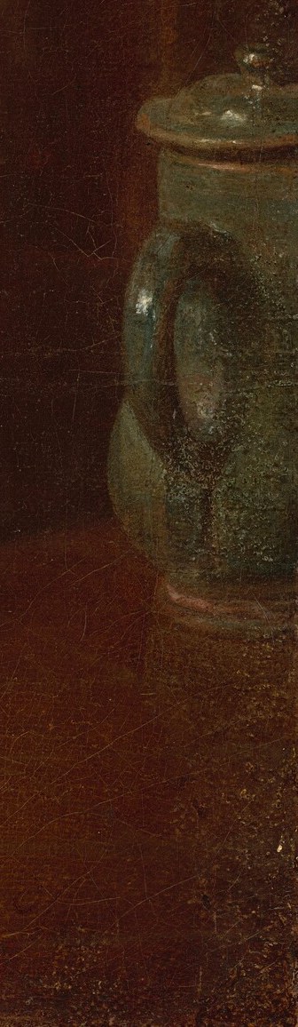 But behind her, a small green pitcher adds a touch of color.