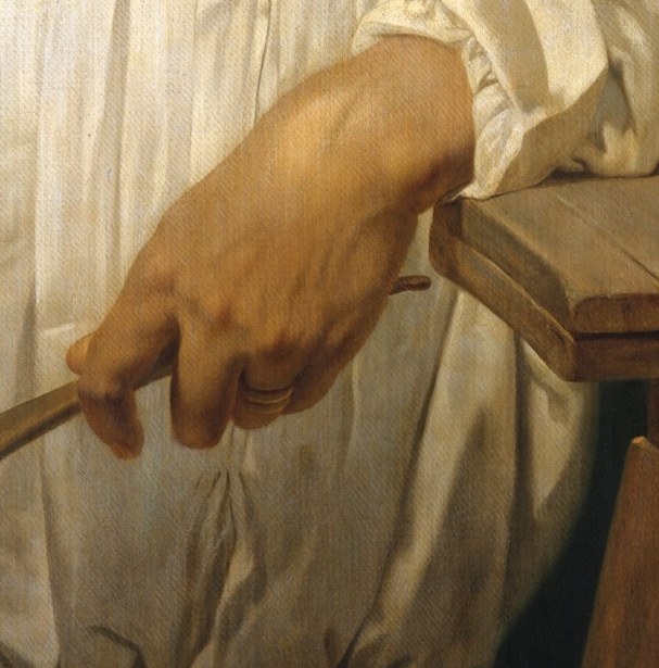 But see what he is holding.