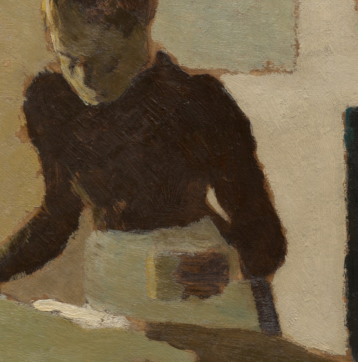 Her posture and bowed head convey deep concentration and perhaps weariness in her task.