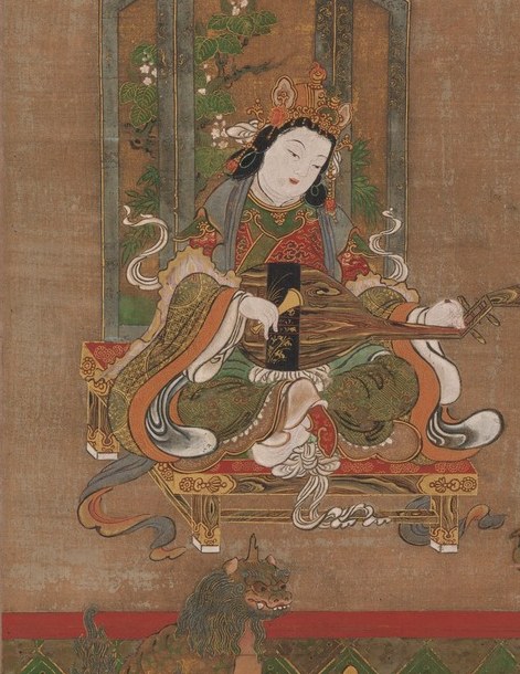Her delicate hands and focus on the instrument convey a sense of peaceful artistry.
