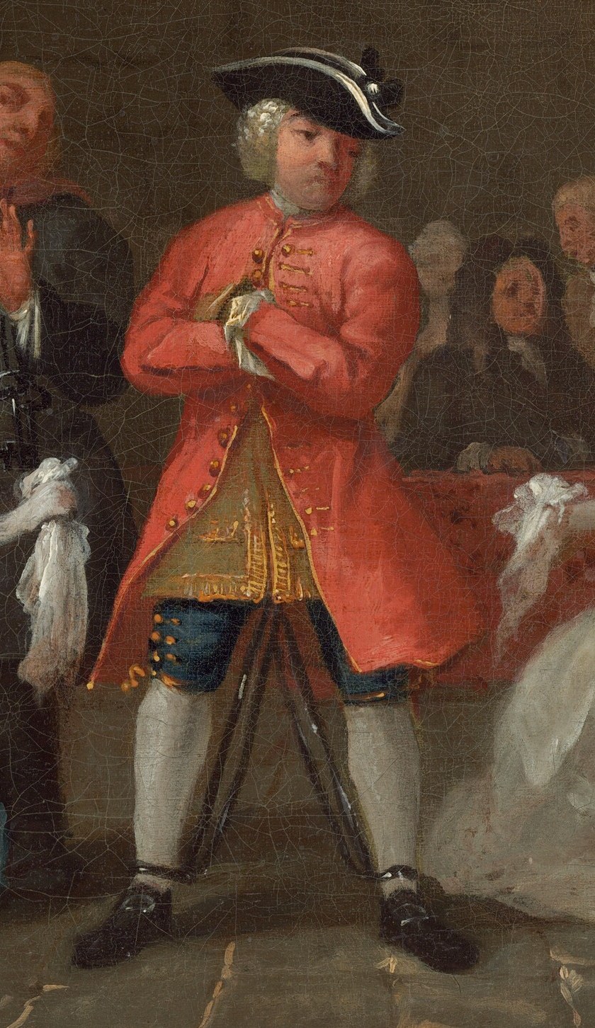 The central figures are the actor, and the actress kneeling before him.
