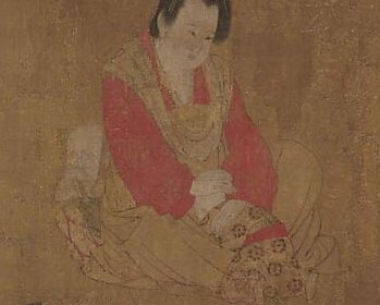 The gentle posture and focused gaze suggest maternal care and tenderness.