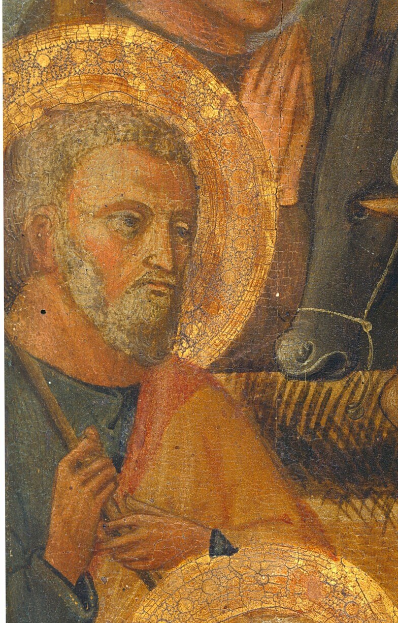 Saint Joseph, with his weathered face, watches over them.