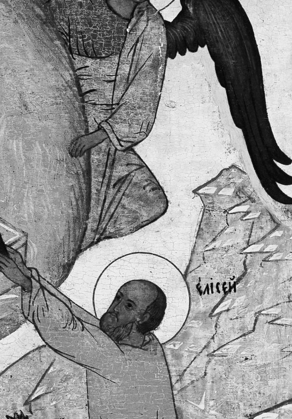 An angel with dark wings guides him.