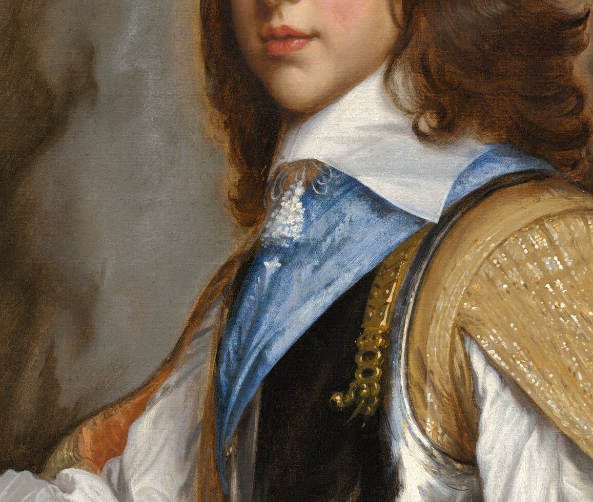 The blue sash across his chest: the Order of the Garter.