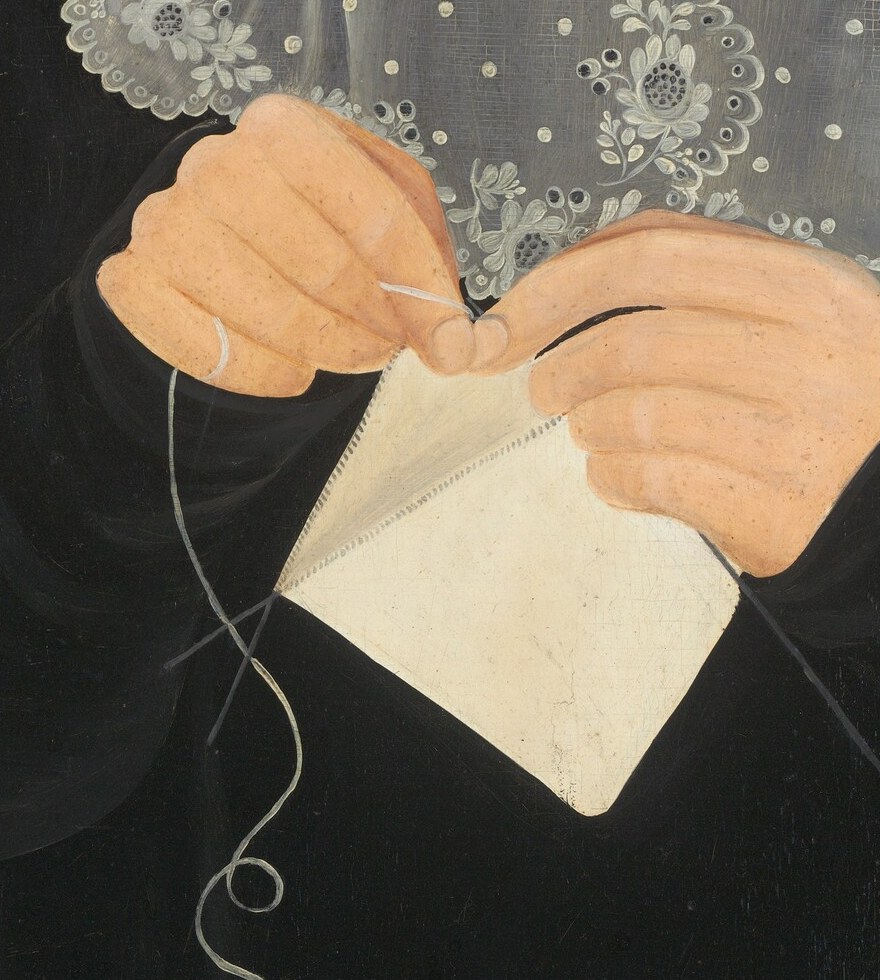 Her hands show skill and patience, a desired trait for women then.