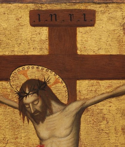 The tilted head and crown of thorns concentrate suffering into a single close-up target; the face conveys exhaustion and peace simultaneously.