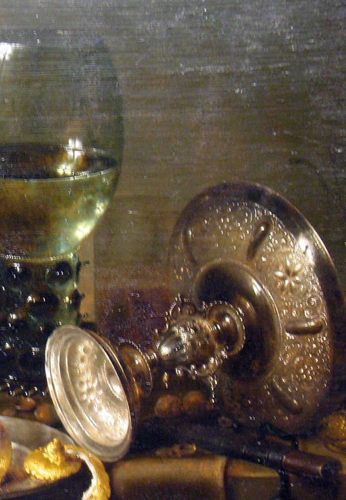 Look at the carved silver. It holds a distorted mirror of the whole room.