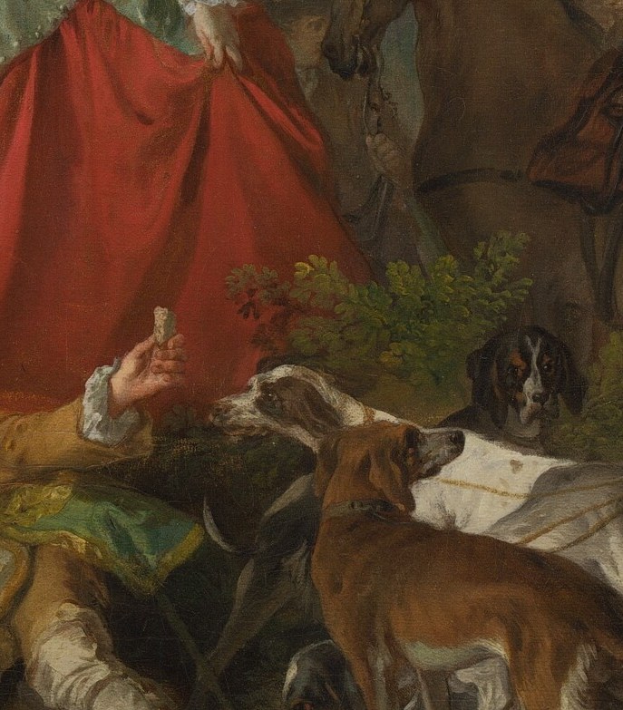 Nearby, a gentleman holds his greyhound on a leash.