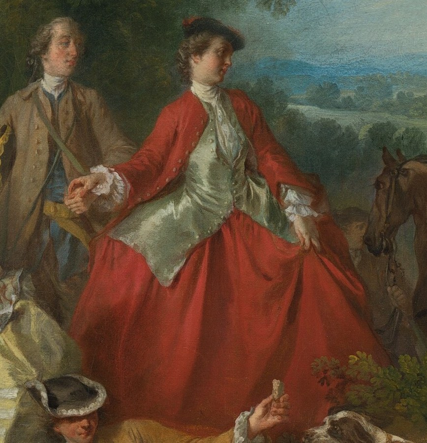 Look at the woman in the elaborate red dress.