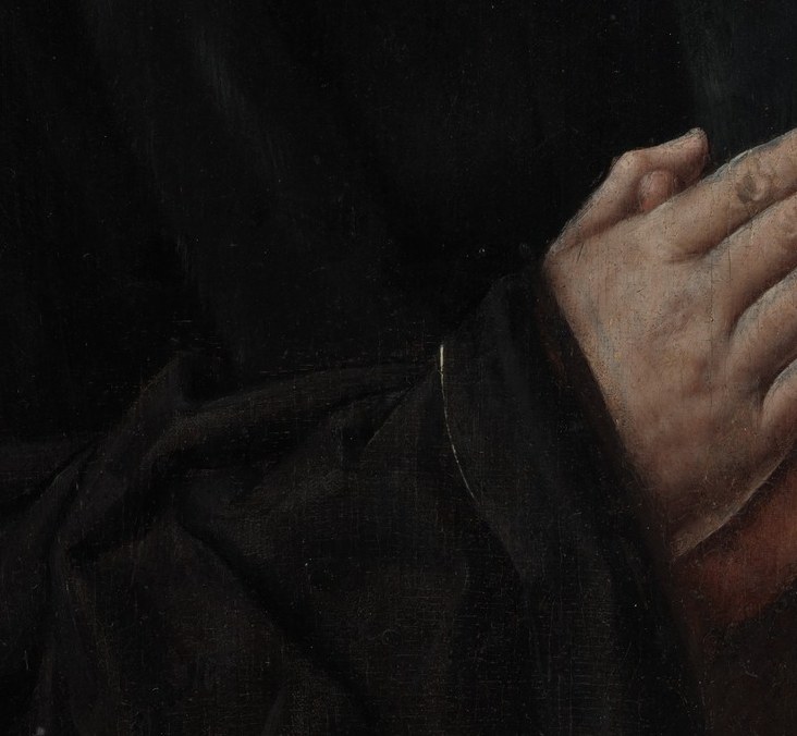 His face. His hands. The rest is void.