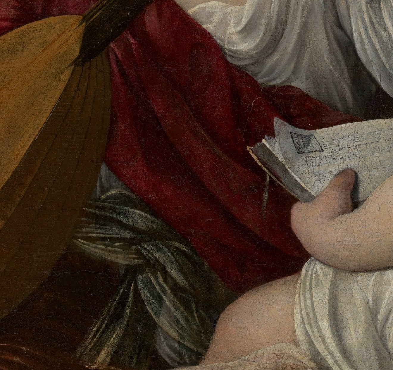 The notation has been partially transcribed by musicologists and contains fragments of real late-16th-century madrigals , a text hiding in plain sight that most gallery visitors walk past unread.
