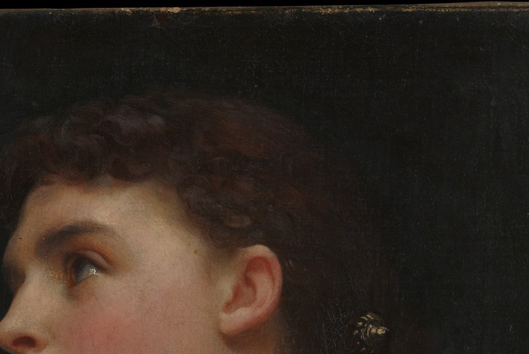 Unadorned and simply dressed, the hair emphasizes the silhouette over ornament , a quiet contrast to the decorated garment below; reflects Pre-Raphaelite preference for natural simplicity