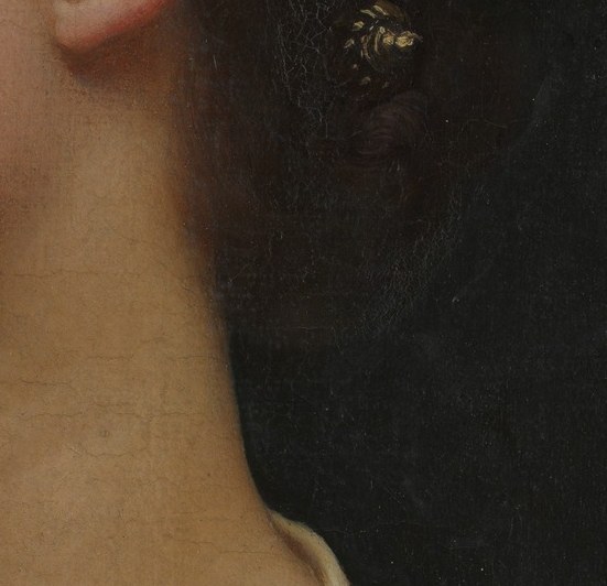 The profile is classical, almost a Roman coin.