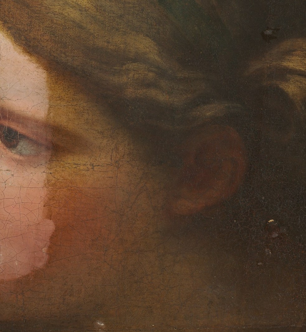 Her face is a study in soft focus, almost blurred.