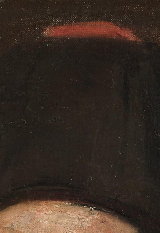 His dark fur hat is a mark of his identity.