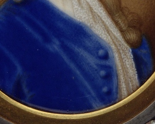 He wears a fashionable blue coat and a delicate white cravat.