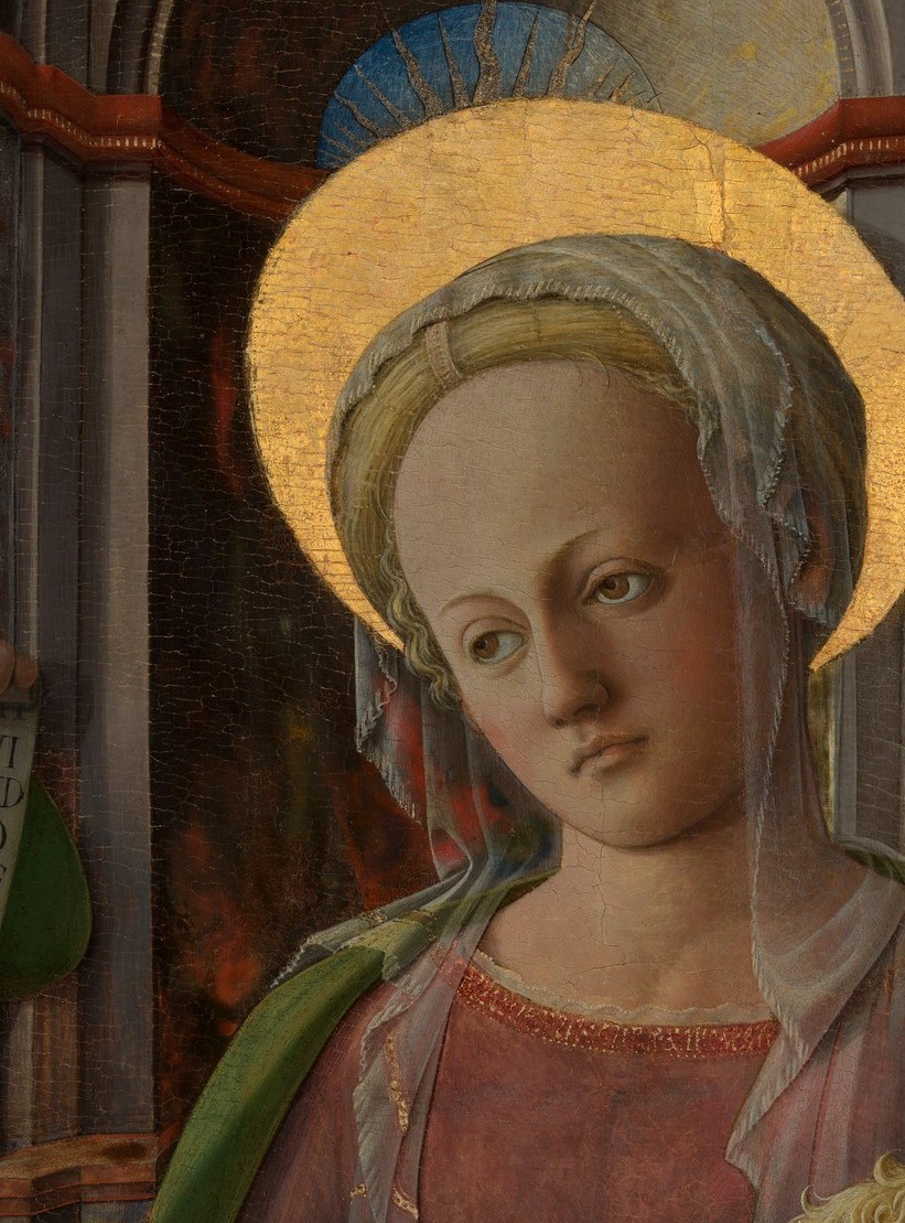 Lippi's hallmark oval face with downcast eyes; the slight tilt toward the Child creates the painting's emotional fulcrum and is the first place a viewer's eye lands.