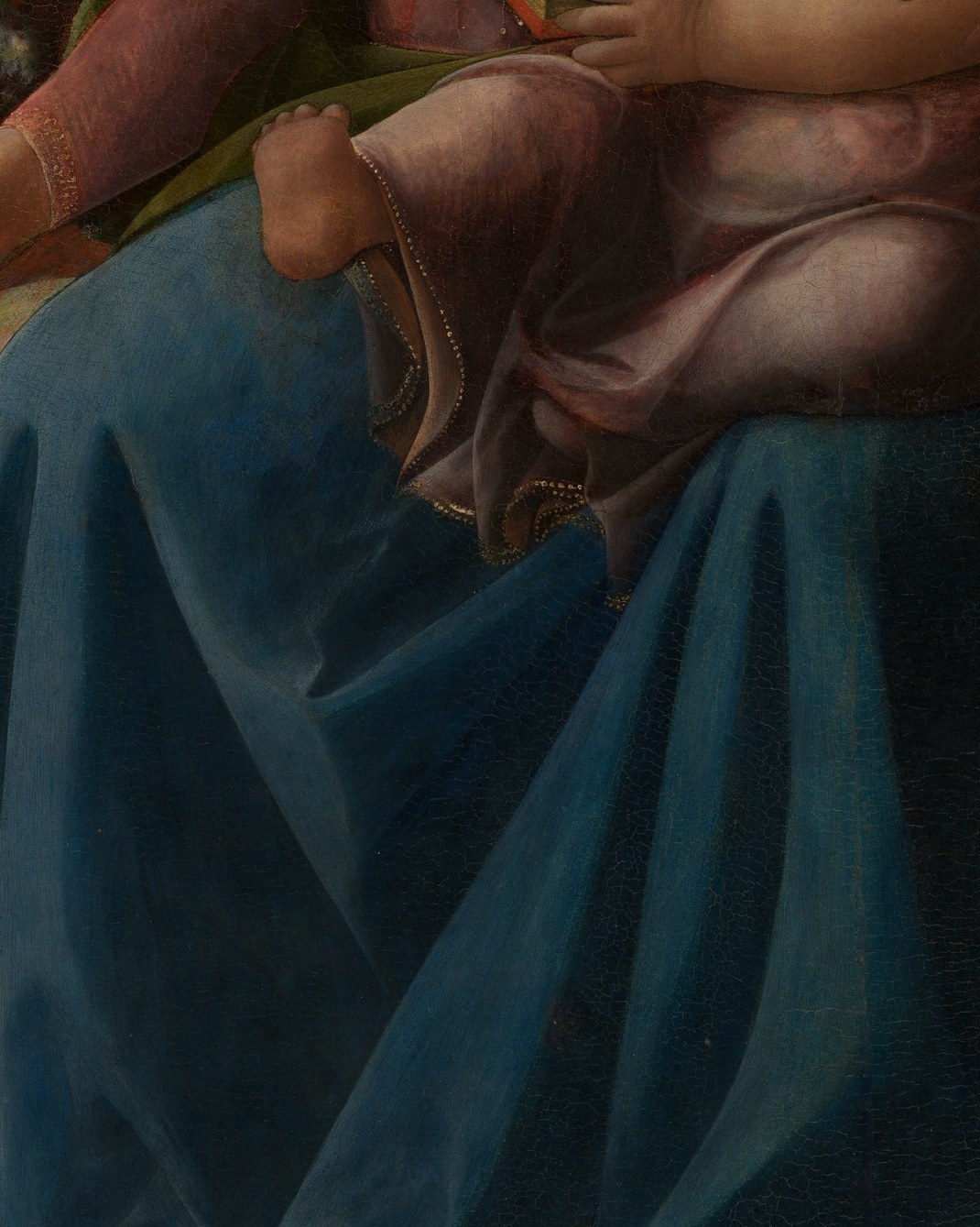 Lippi's tempera allows crisp contour on the fingers; the gentle grip communicates maternal tenderness without sentimentality.