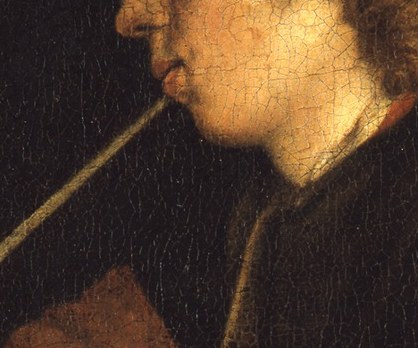 He smokes a Gouda clay pipe, a common pleasure of the era.