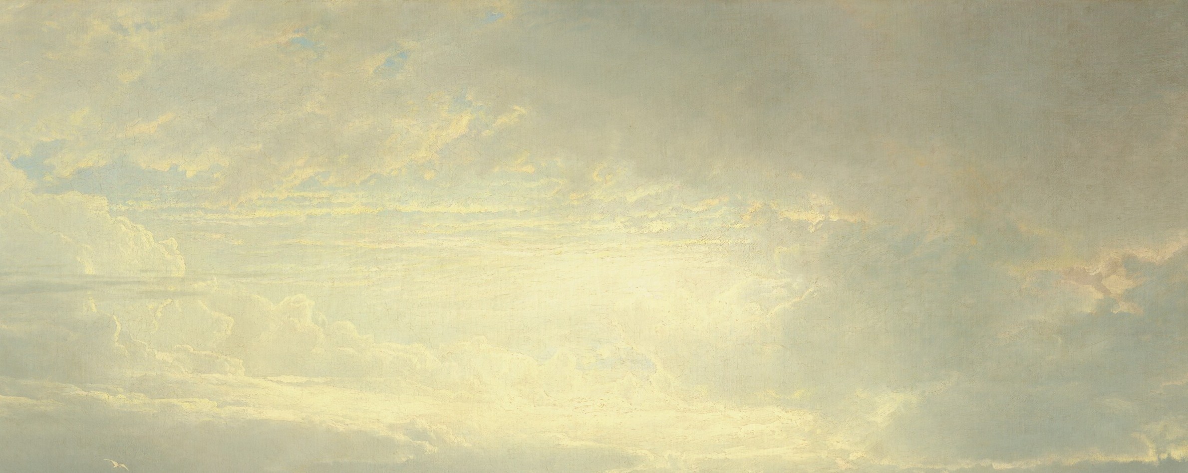 A moment of sunlight piercing the dramatic clouds.