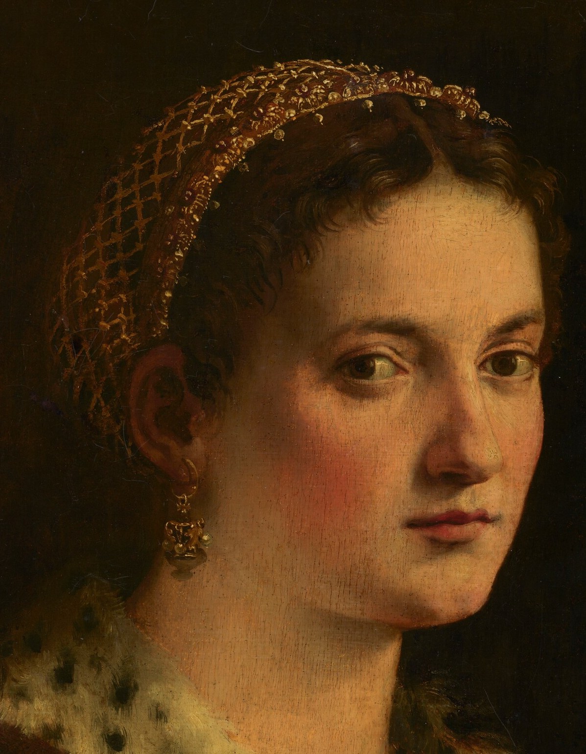 The artist used subtle glazing to create depth in her expression.