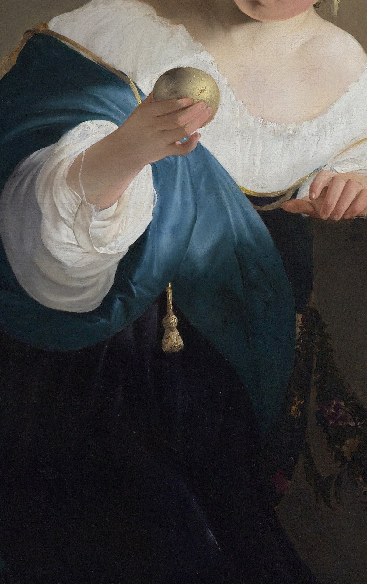The rich, deep blue of the shawl contrasts with her skin and white garment, adding depth and visual interest.