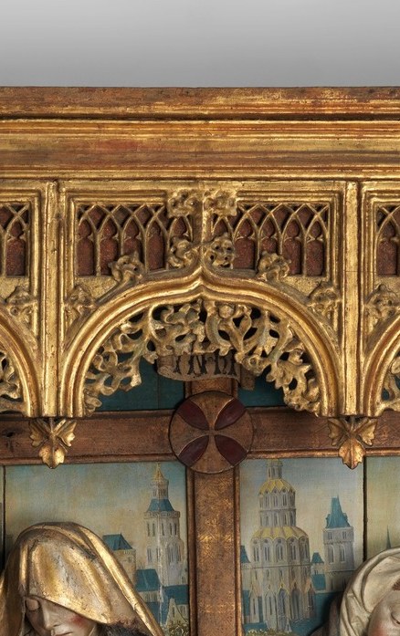 That is a flat, painted panel. Two-dimensional. Not carved.