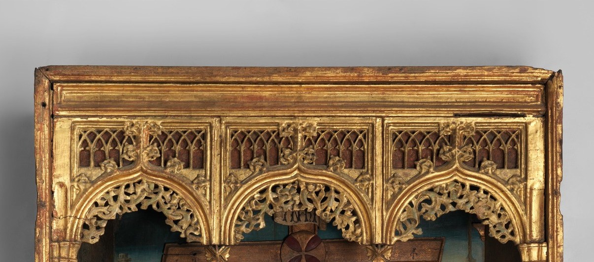 The ornate gold canopy marks this as a devotional altarpiece niche; the interplay of Gothic ornament with somber grief is a key art-historical detail