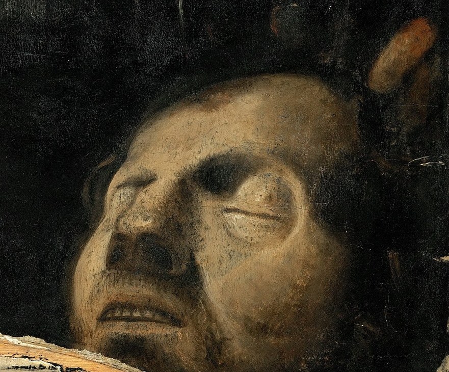 The lifeless, pale face contrasts sharply with David's vibrant youth, emphasizing the victory.