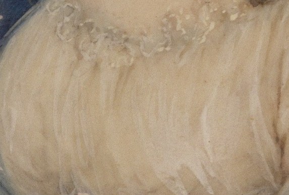 Now look at the single spot of color on her dress.