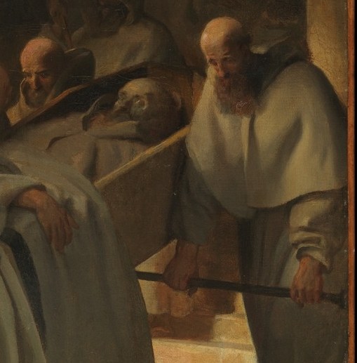 He holds a processional cross for the deceased.