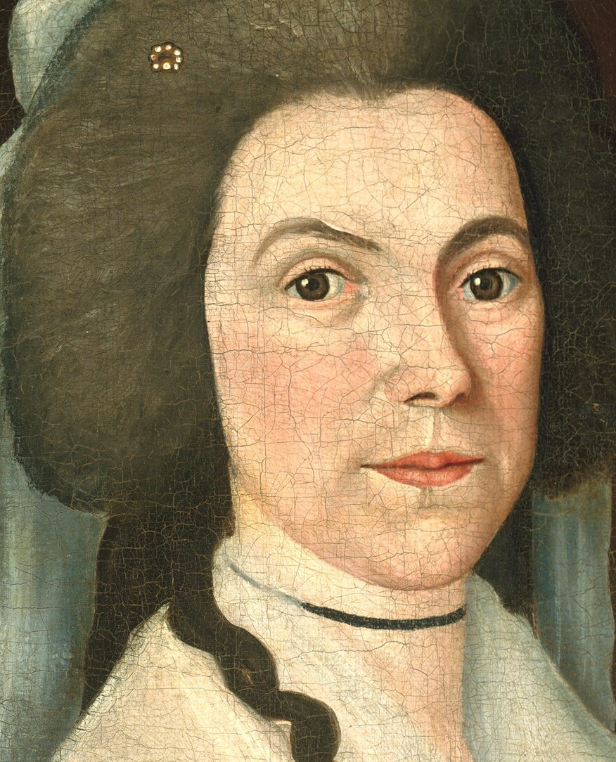 Her calm expression reflects an era's ideal of modesty.