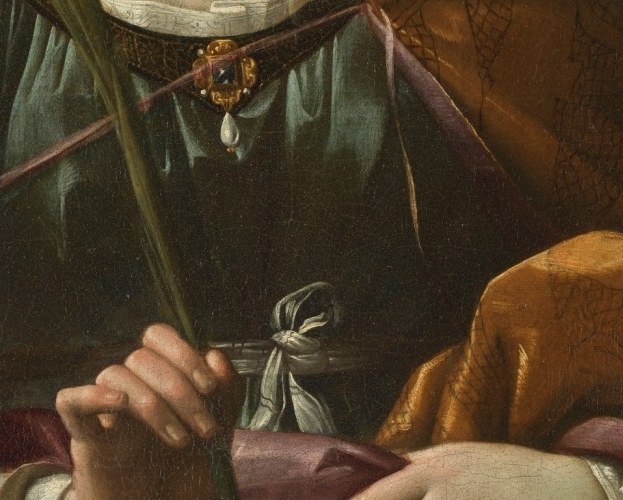 Notice the rich, pink lining of her robe.