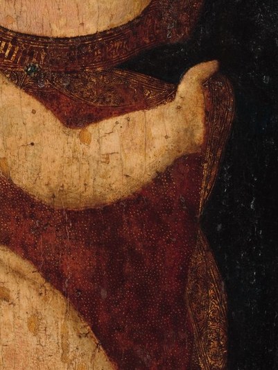 And watch his right hand. It clings. A child gripping his mother.
