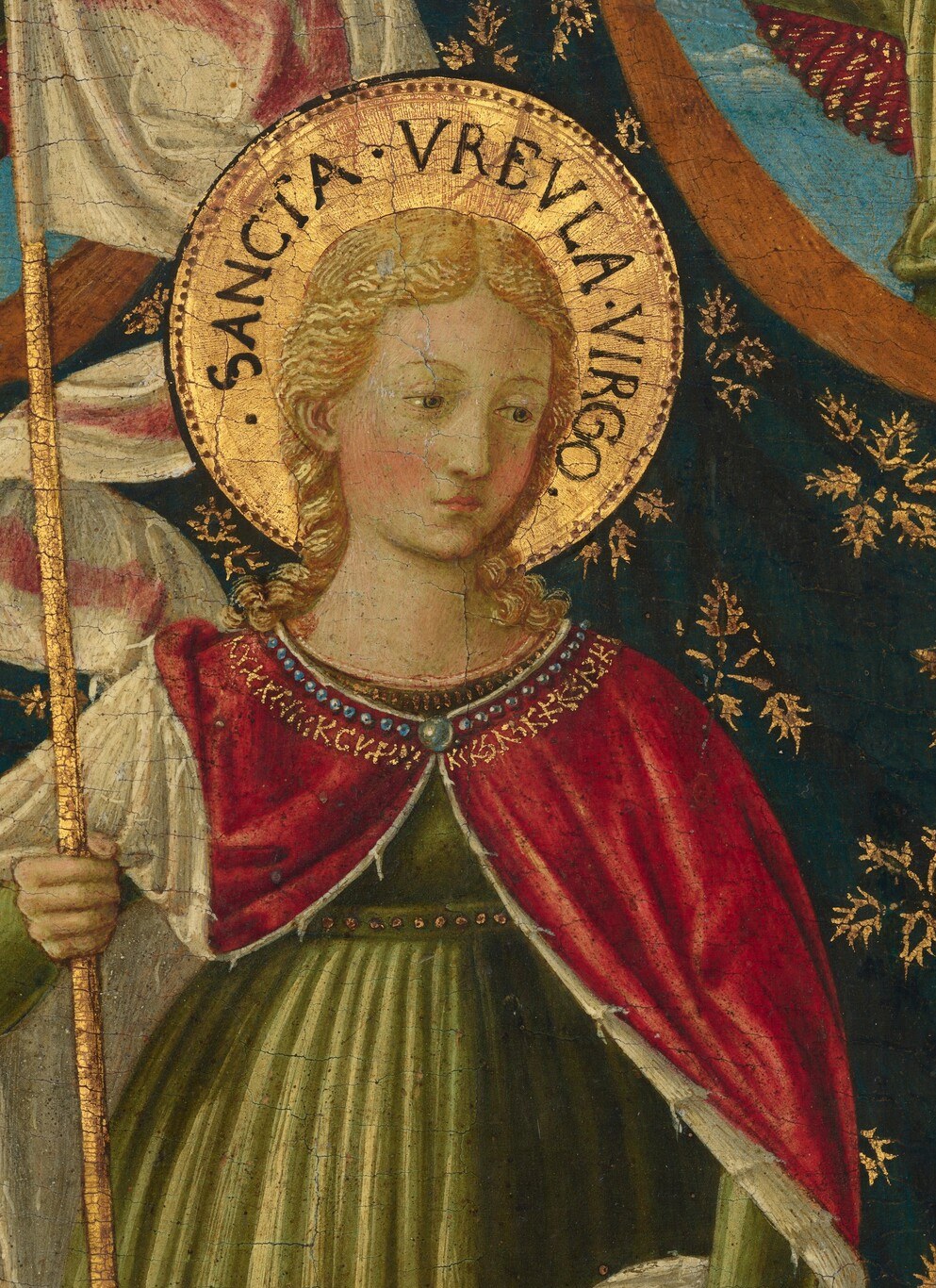 And angels hold a banner so we know her name.