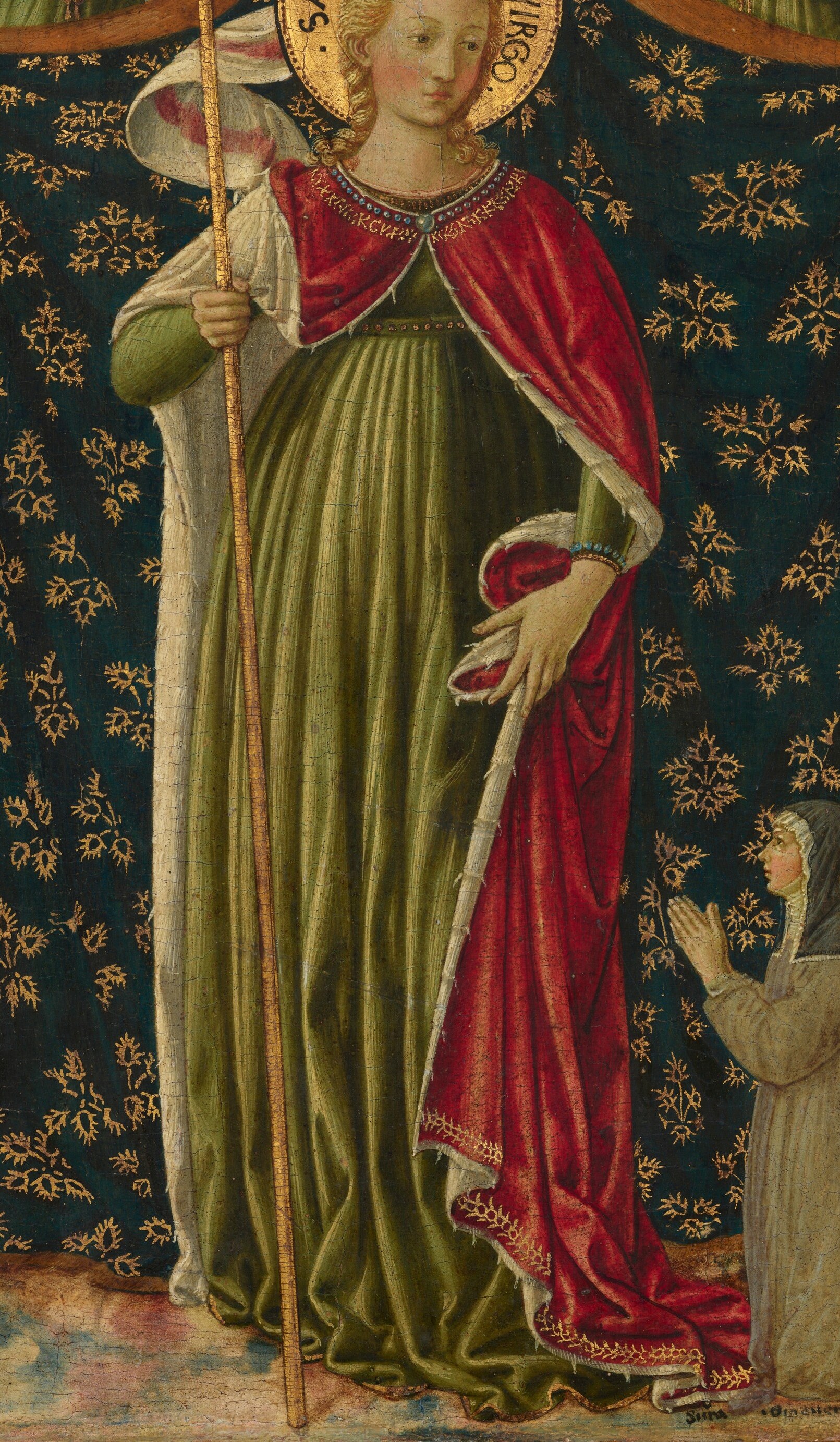 Saint Ursula, towering in red and gold.