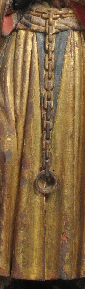 This detail adds to the saint's attire and suggests a monastic or religious order, hinting at his identity.