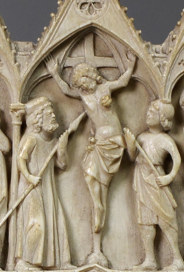 Above: Christ bears the cross toward his death.