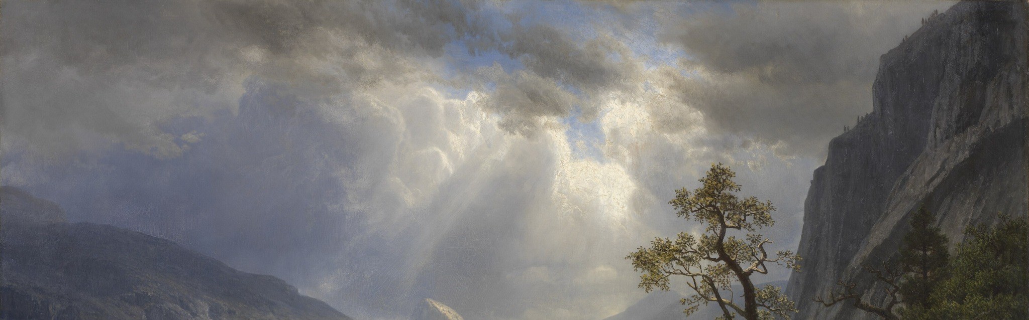 Dark roiling clouds frame the light burst and give the sky more drama than the land; the contrast is the painting's emotional engine.
