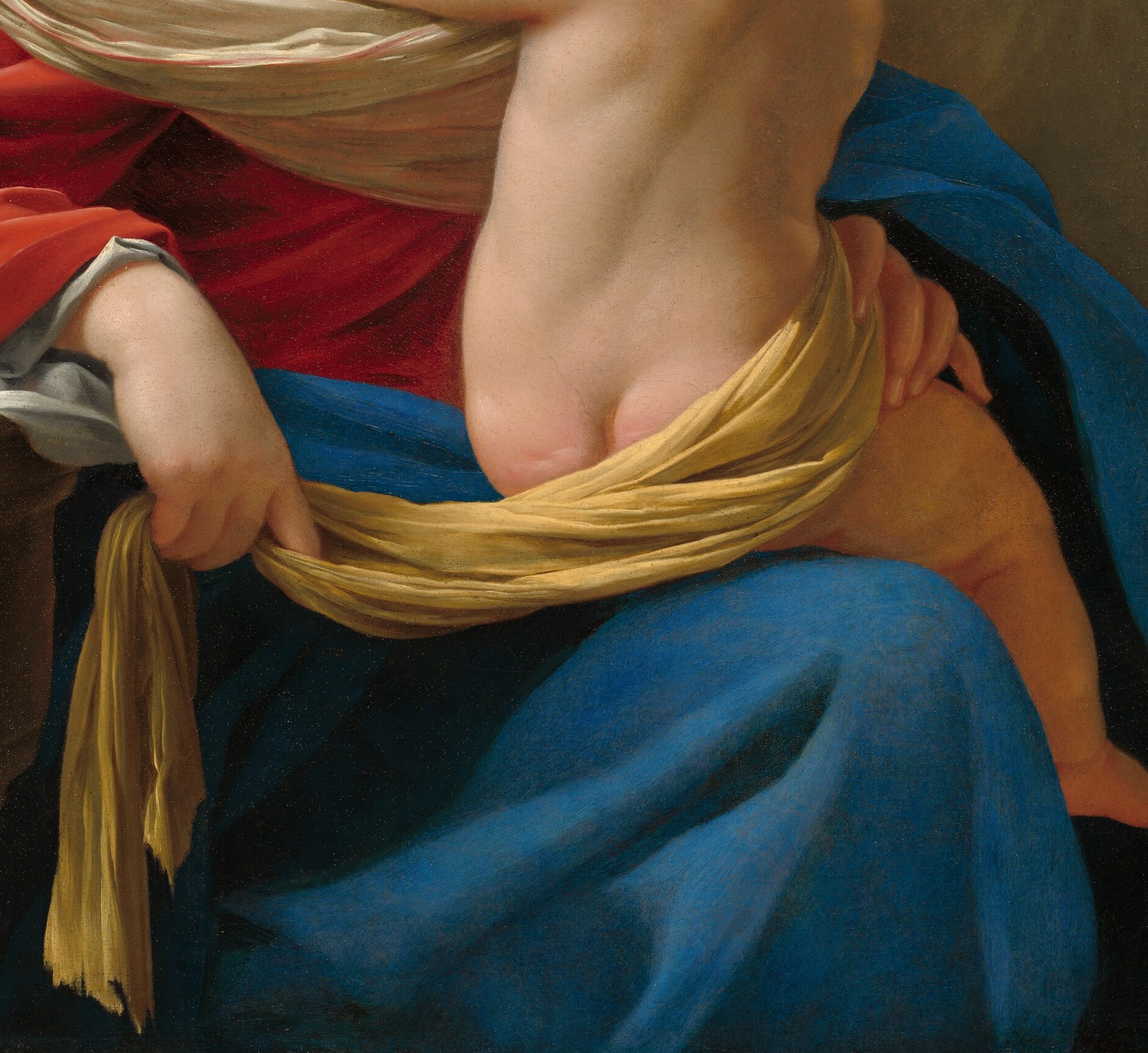 The Child's gold drapery echoes divine light.