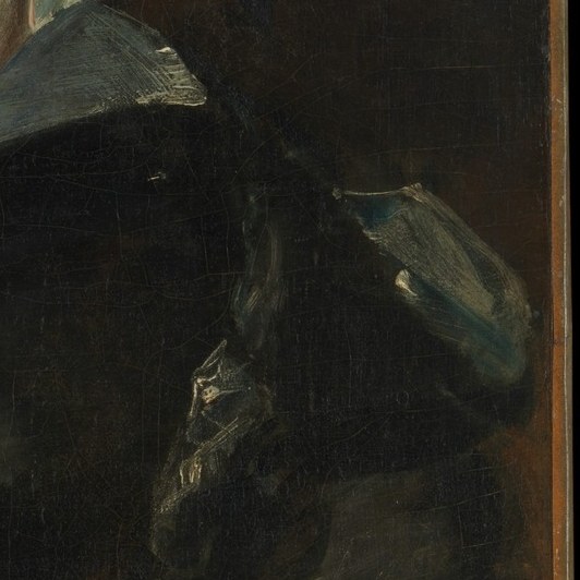 The soft light on her shoulder reveals the rich fabric texture.