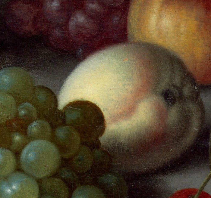 The soft fuzz of the peach, and tiny glints on the cherries.