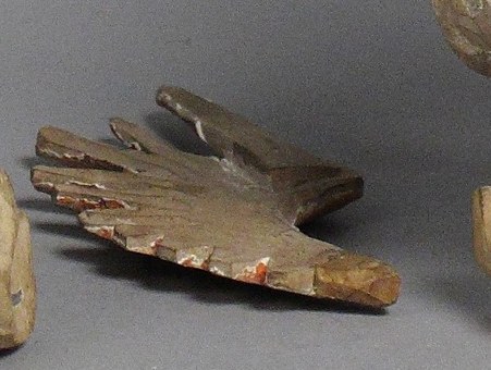A fallen wing fragment rests in the foreground.